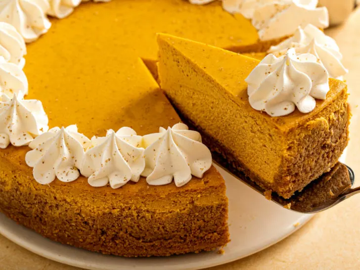 keto pumpkin cheesecake with a dollop of whipped cream
