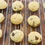 Soft baked keto cream cheese chocolate chip cookies on baking rack cooling