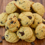 keto cream cheese chocolate chip cookies stacked on a wooden stand