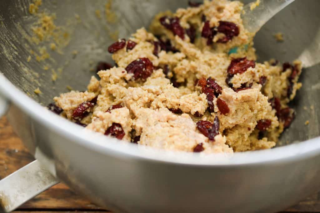 keto oatmeal cranberry cookie dough in a metal mixing bowl