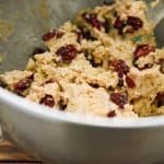 keto oatmeal cranberry cookie dough in a metal mixing bowl