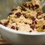 keto oatmeal cranberry cookie dough in a metal mixing bowl