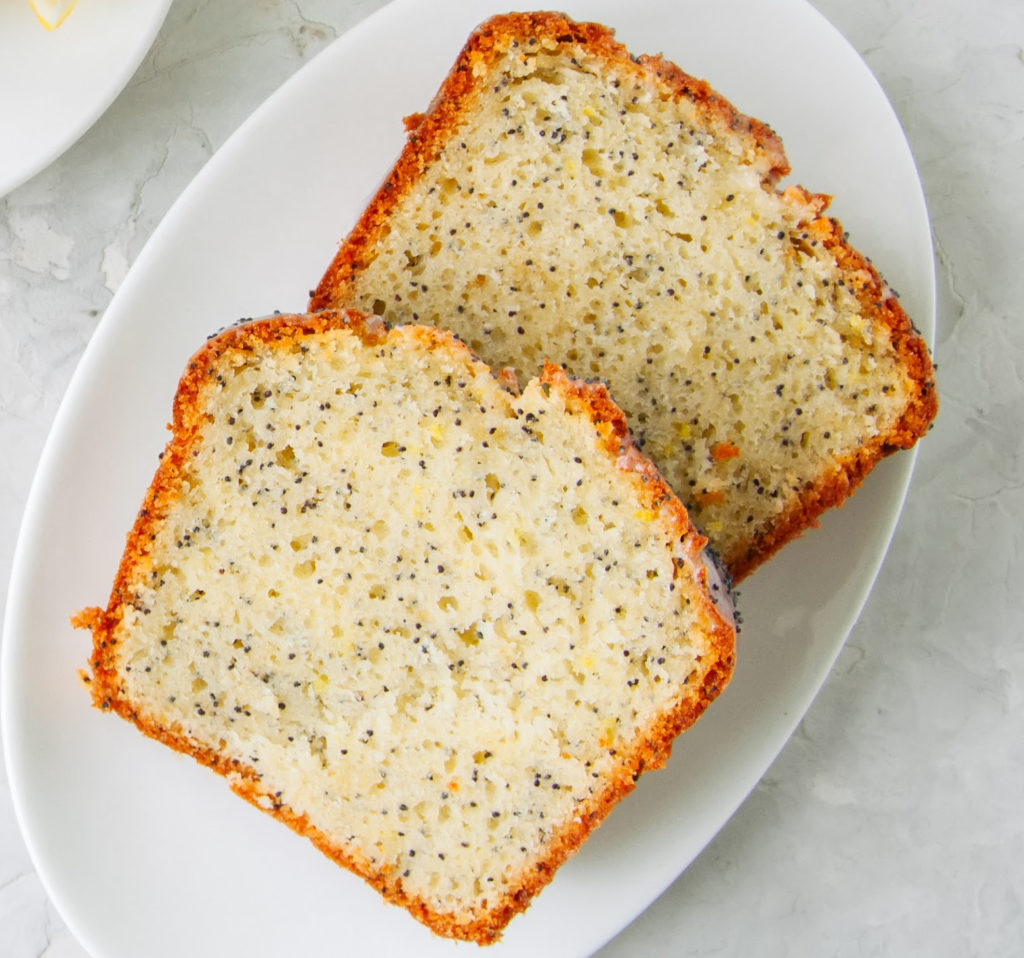 keto poppy seed lemon pound cake slices on a white plate