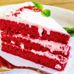 keto red velvet cake sliced and served on a white plate