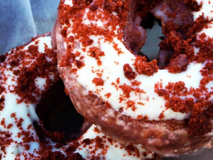 keto red velvet donuts close up stacked on plate