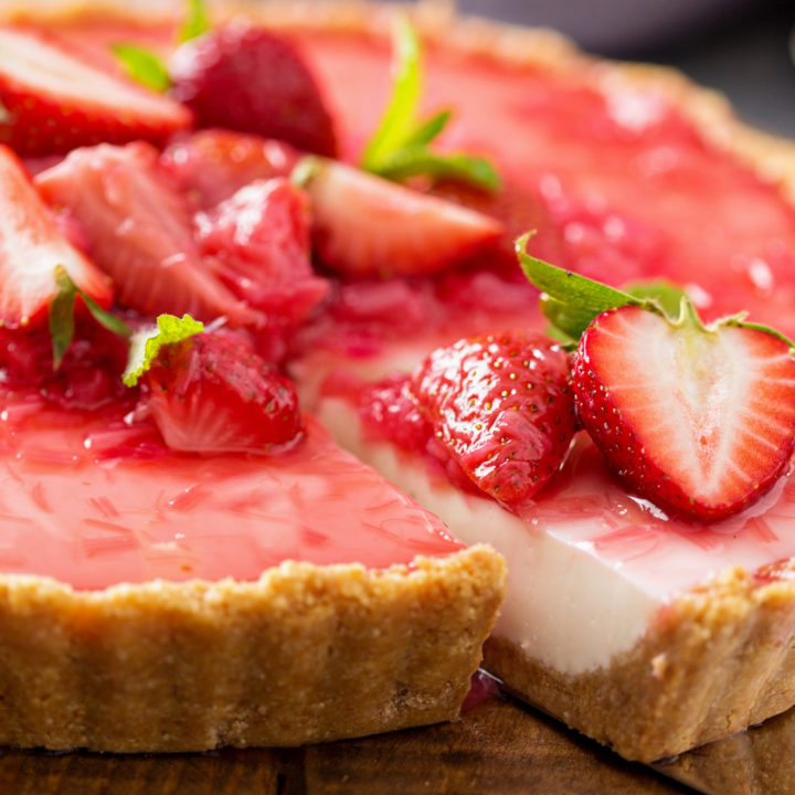 keto strawberry rhubarb cheesecake sliced and ready to serve