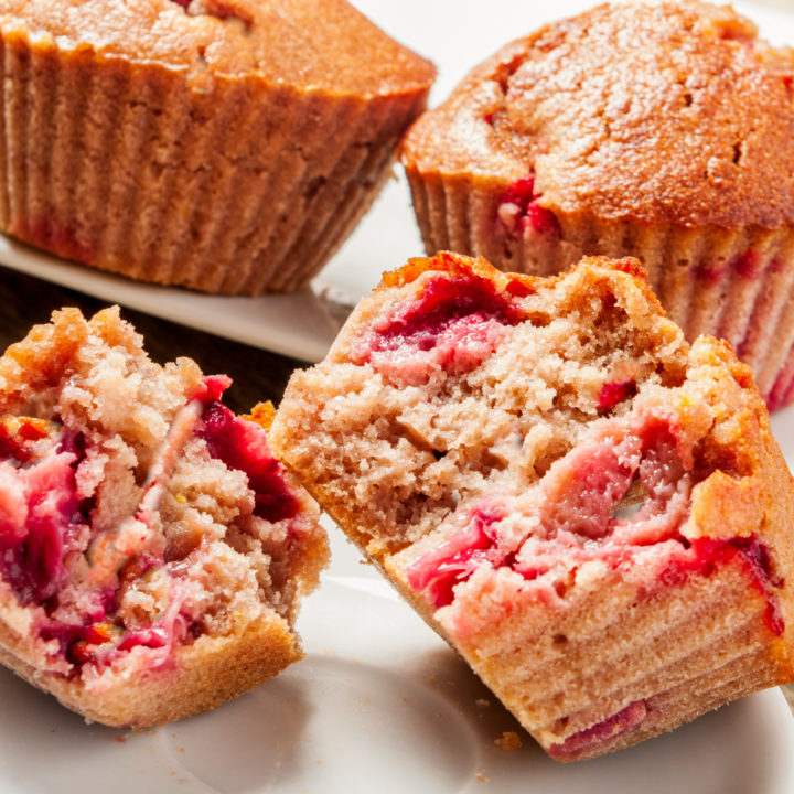 keto strawberry rhubarb muffins displayed on white plates