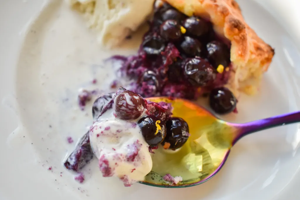 Keto Blueberry Galette with ice cream on a spoon
