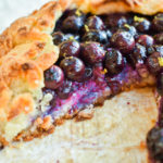 Keto blueberry galette with slice removed and upclose