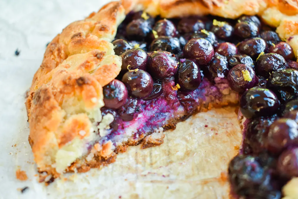 Keto blueberry galette with slice removed and upclose