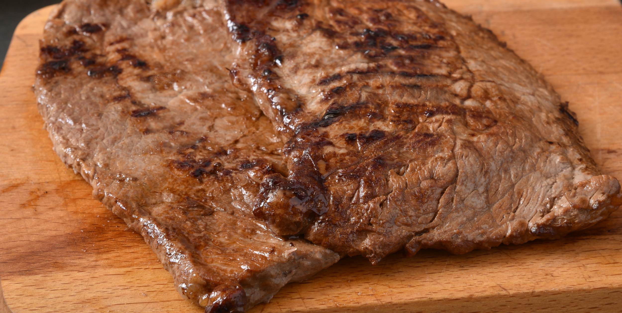 Fresh panfried Cuban steaks on a cutting board