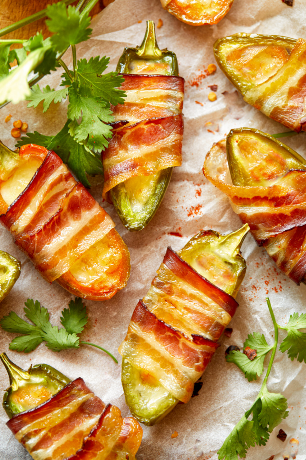 keto bacon jalapeño poppers on a piece of parchment paper