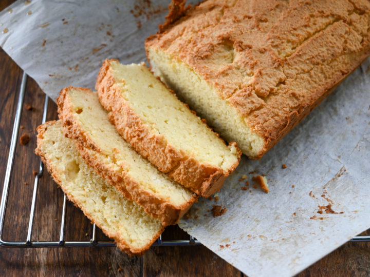 keto sour cream bread sliced on a cooling rack