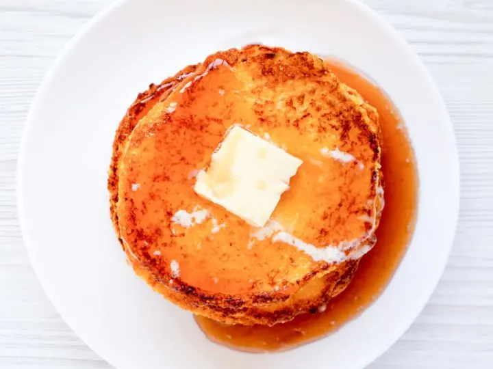 keto Johnny Cakes on a white plate and white table