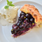 keto friendly blueberry galette with a scoop of vanilla ice cream