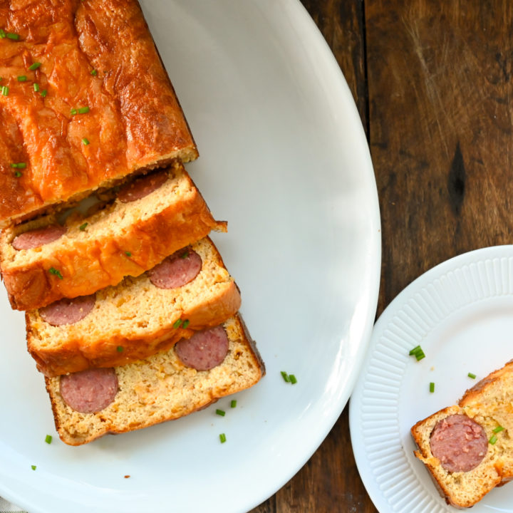 Keto kielbasa cornbread on a white plater sliced