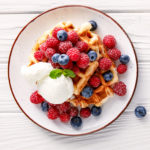 keto waffles served with blueberries and an ice cream scoop as dessert