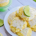 keto lime cookies served on a white plate and displayed on a white wood board