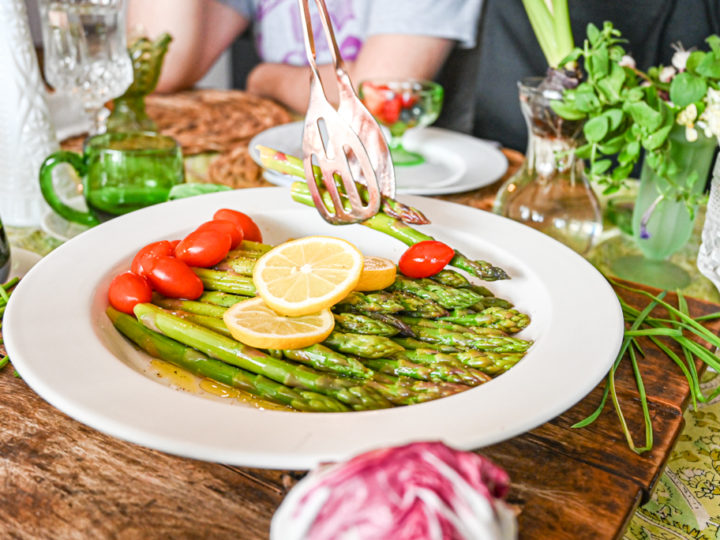keto asparagus salad served on white plate on table