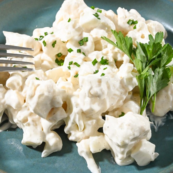 keto cauliflower salad on a teal plate