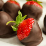 keto chocolate covered strawberries on a white plate