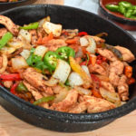 keto chicken fajitas in a black cast iron skillet