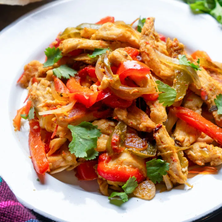 keto chicken fajitas served on a white plate