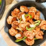 keto shrimp fajitas cooked in a black cast iron skillet