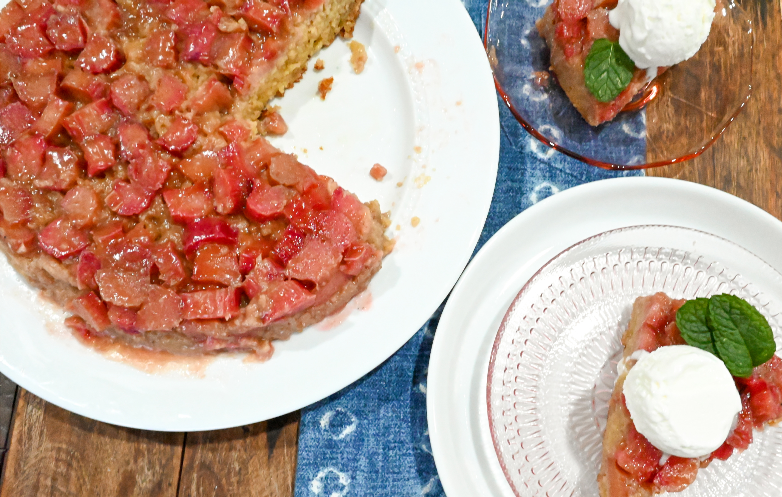 keto rhubarb upside down cake on a white cake plate