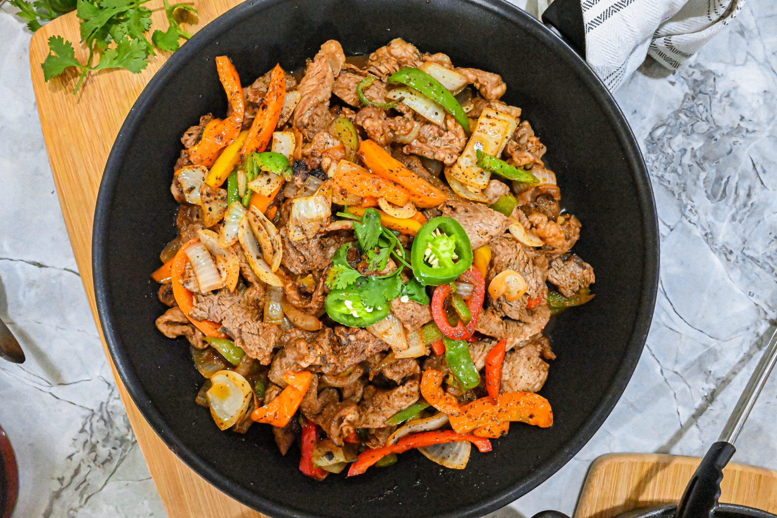 keto steak fajitas in cast iron skillet close up