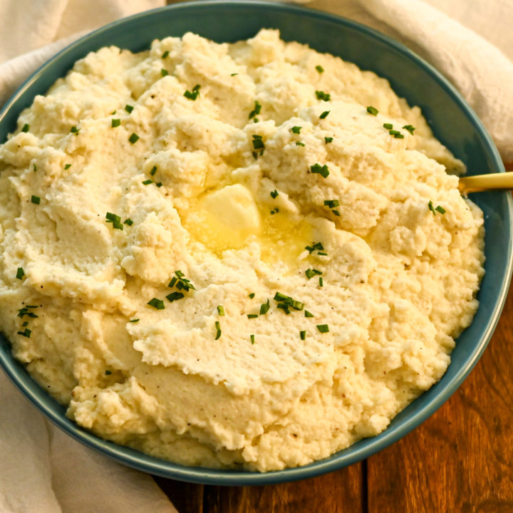 Keto cauliflower mash served in a teal bowl