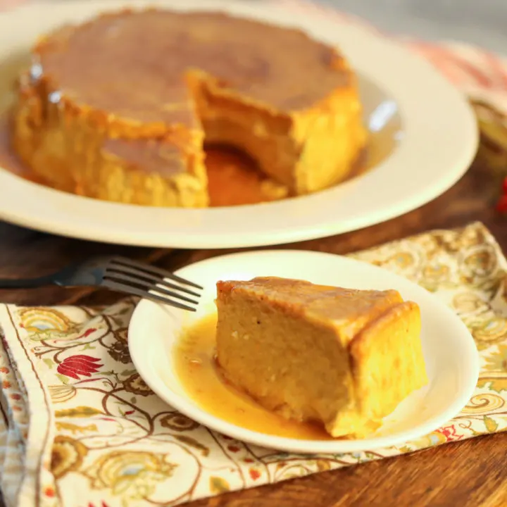 keto pumpkin flan sliced and ready to serve on wood board