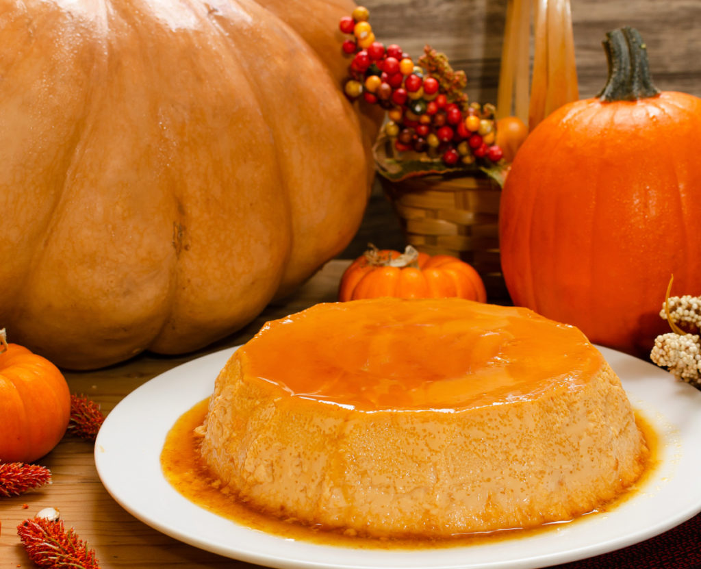 Keto pumpkin flan with pumpkins in the background