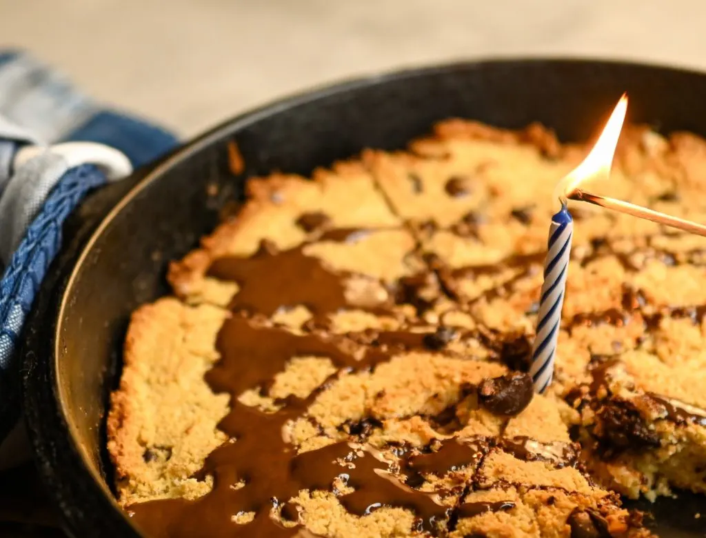 keto chocolate chip scones with a blue birthday candle