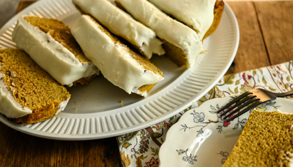 keto coconut flour pumpkin bread featured image sliced on a white platter