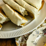 keto coconut flour pumpkin bread featured image sliced on a white platter