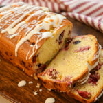 keto cranberry orange bread served on a wood board