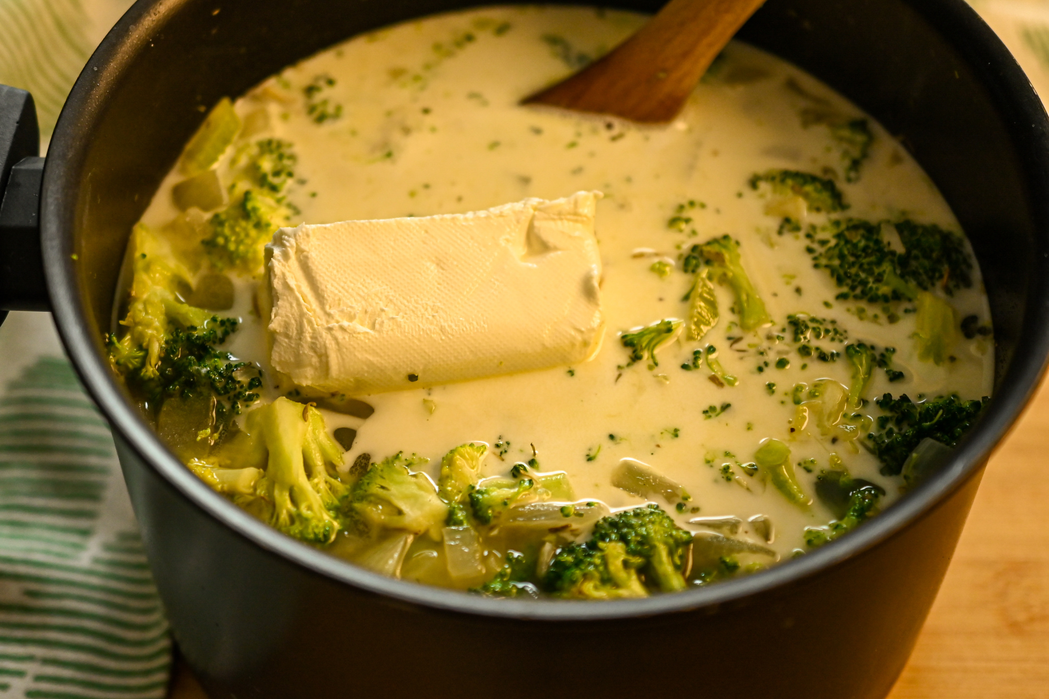 keto cream of broccoli soup being made in a 5 quart pot