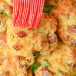close up of keto ham and cheese biscuits brushed with melted butter