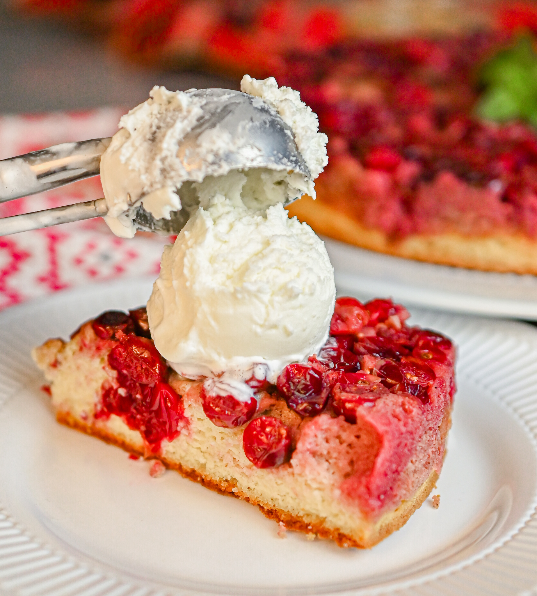 keto cranberry upside down cake with ice cream scoop served on top