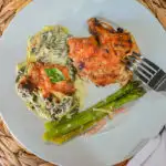 keto creamed spinach served with roasted chicken and asparagus