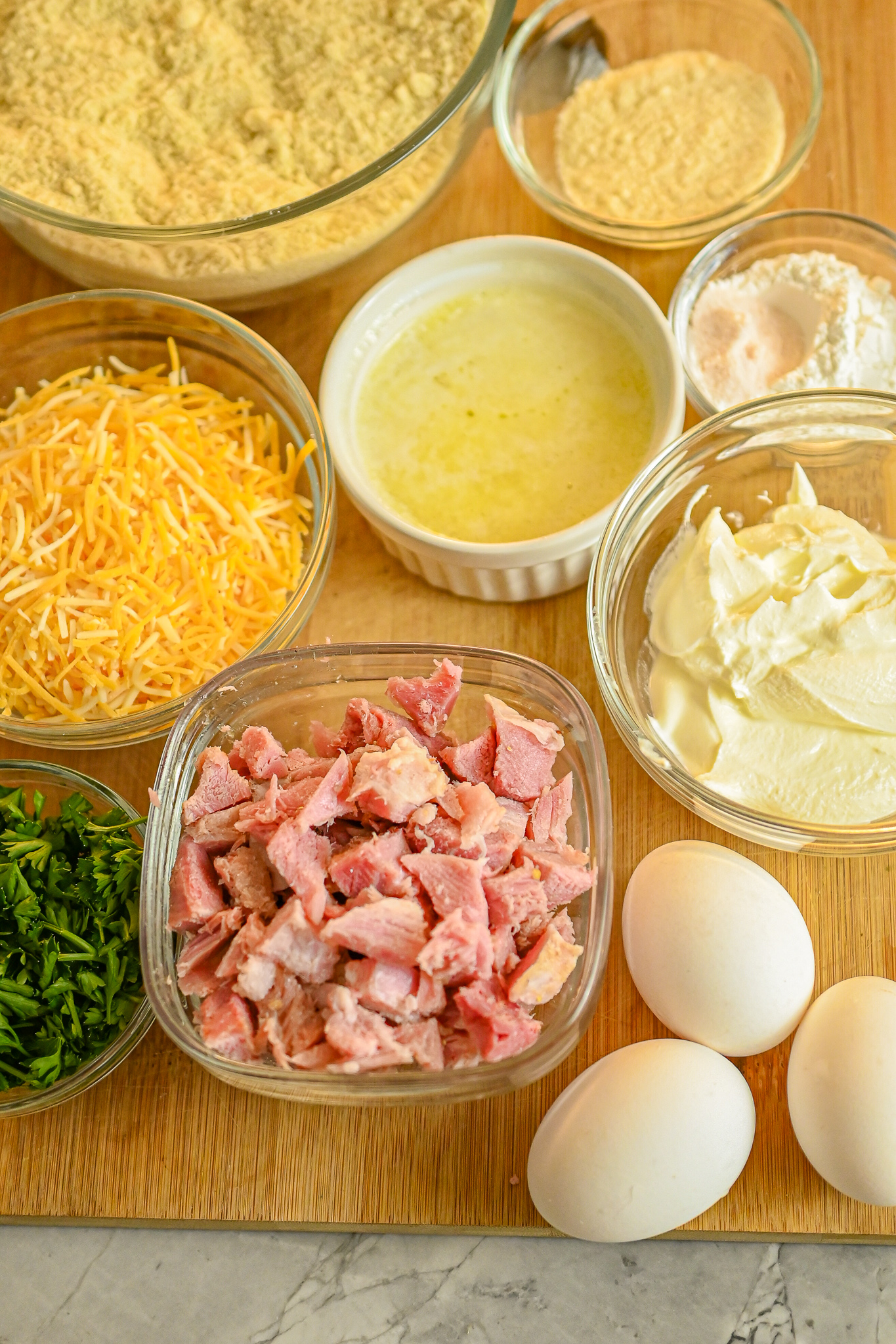 keto ham and cheese drop biscuits ingredients on wood board