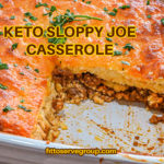 keto sloppy joe cornbread casserole with a slice missing in white baking dish