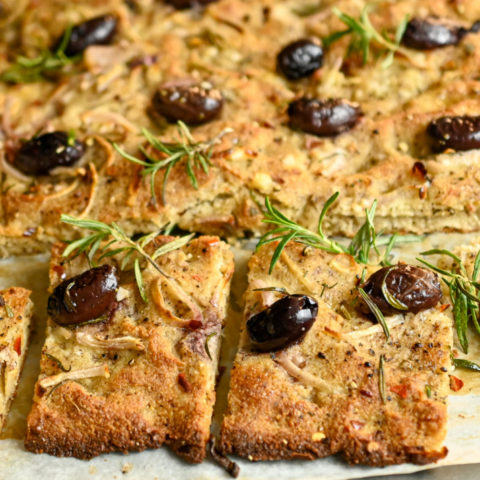 keto focaccia bread sliced on a baking sheet