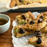 keto focaccia olive bread served on a wooden board