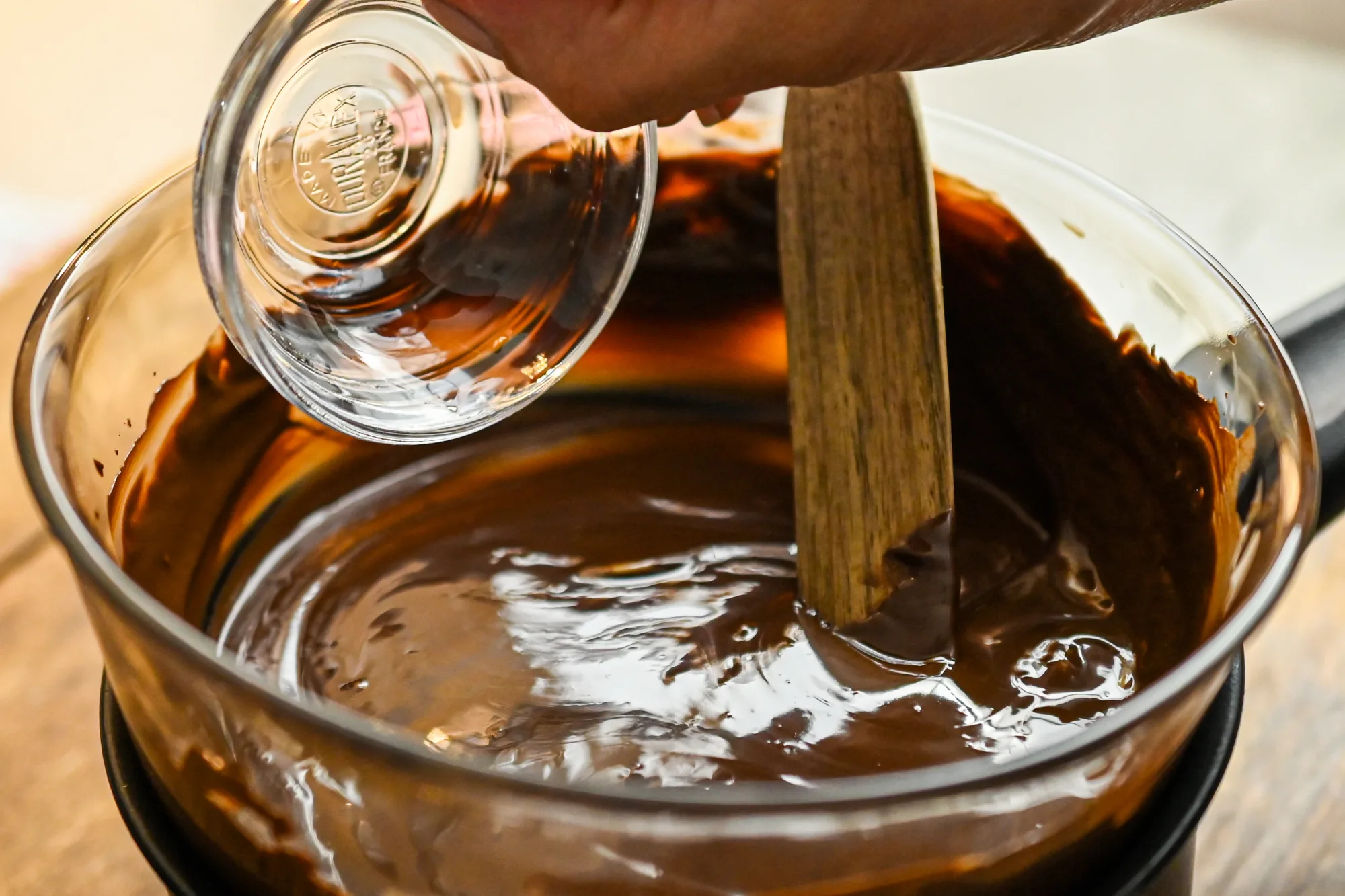 peppermint extract being added to melted chocolate