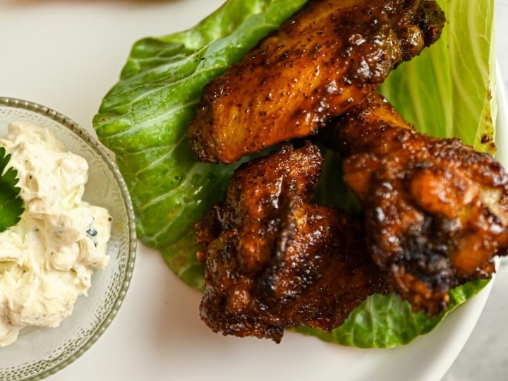 keto chipotle sweet and spicy baked wings with a side of blue cheese sauce