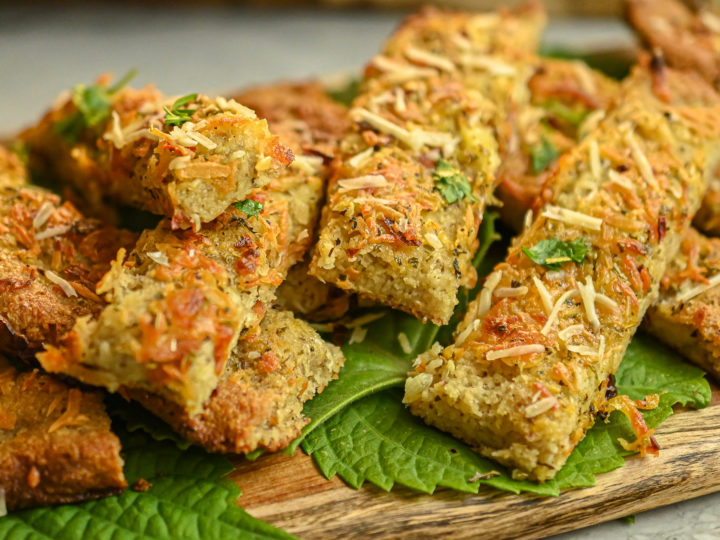 keto garlic bread on wood board close up