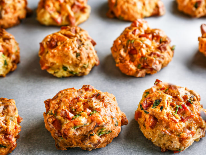 keto sausage balls baked on a baking sheet