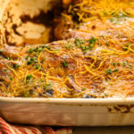 keto beef enchiladas baked in a white baking dish
